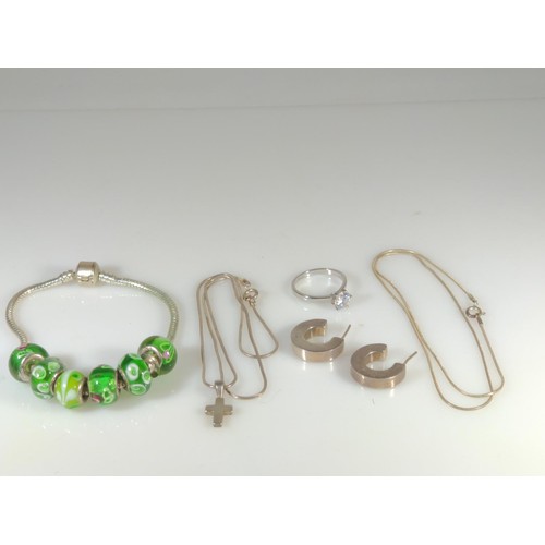 590 - Silver jewellery, including charm bracelet with glass beads, ring, pendant, two chains and a pair of... 