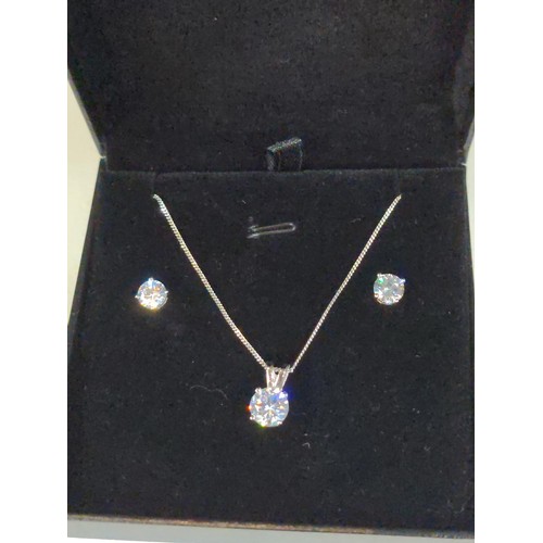 595 - Silver mounted pendant with chain and ear stud set