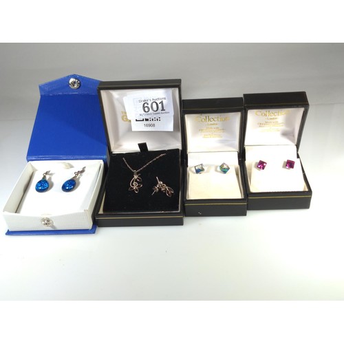 601 - Four pairs of silver mounted earrings, including one with matching pendant with chain