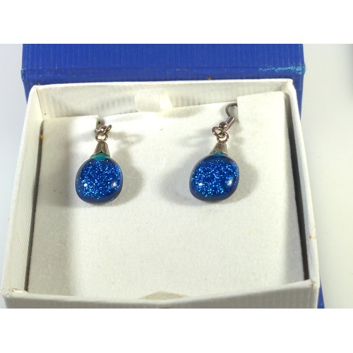 601 - Four pairs of silver mounted earrings, including one with matching pendant with chain