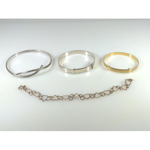 603 - Four various silver bracelets, one set with three small diamonds, gross weight 30 grams