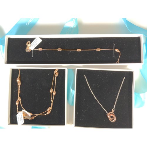 604 - Two silver necklaces, one with a matching bracelet