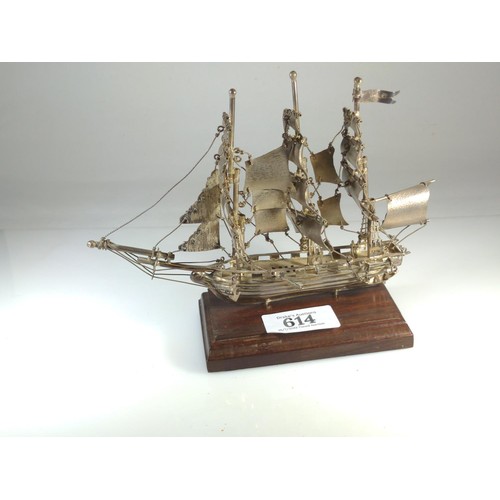 614 - Silver model ship on wooden plinth, marked 'Mexico 925', overall height 14cm, silver weight 96 grams