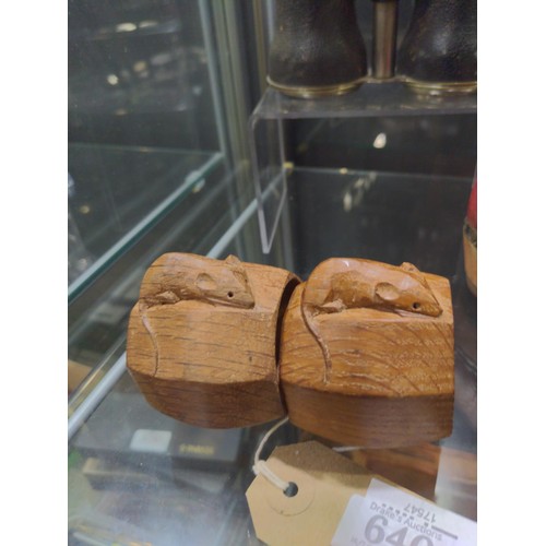 640 - Robert Mouseman Thompson of Kilburn, a pair of octagonal oak napkin rings with carved mouse 'signatu... 