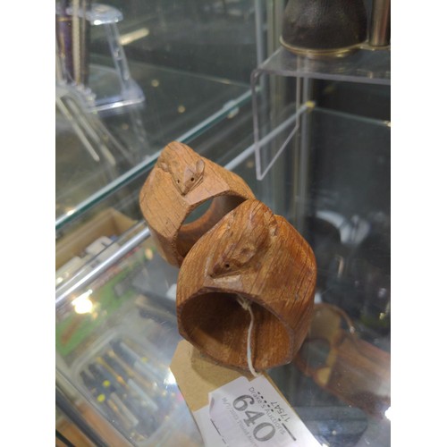 640 - Robert Mouseman Thompson of Kilburn, a pair of octagonal oak napkin rings with carved mouse 'signatu... 