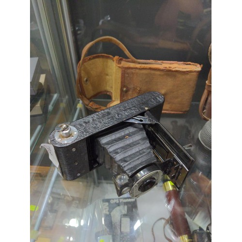 642 - The Myna folding camera with case and two pairs of vintage binoculars, one with case