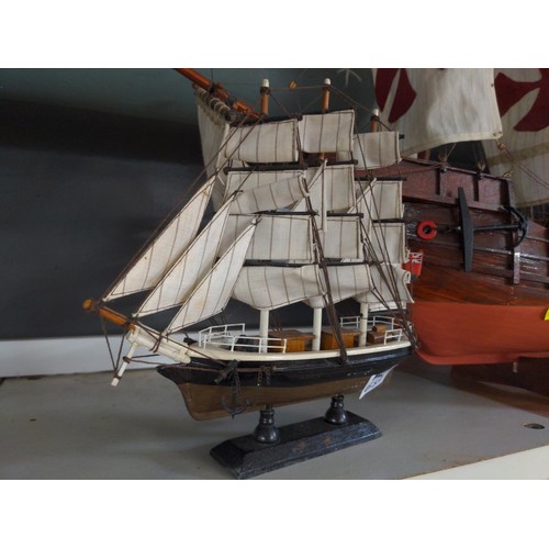 652 - Two model ships, largest 82cm length, smaller 24cm wide