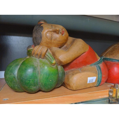 655 - Pair of Asian carved wooden figures sleeping on pumpkins, length 36cm