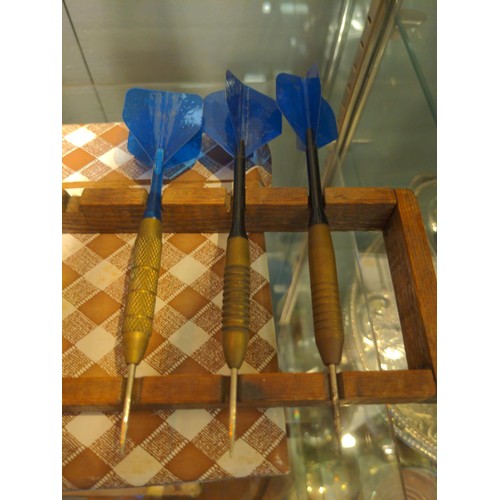 677 - Collection of darts, both wooden & brass with a darts stand