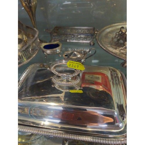 693 - Full shelf of mixed silver plated ware inc galleried tray; salts; 2 serving dishes plus others