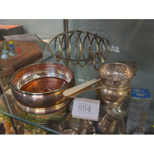 694 - Plated ware inc toast rack, wine coaster, tea strainers & small bowl