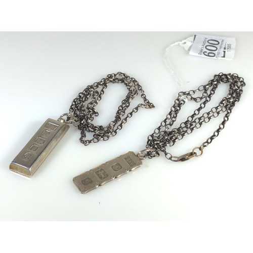 600 - Two silver ingot pendants with chains, gross weight 57.4 grams