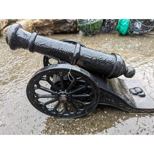 142 - Early C19th. French wrought iron Canon ornament, canon length 60cm, overall L66 x W32cm