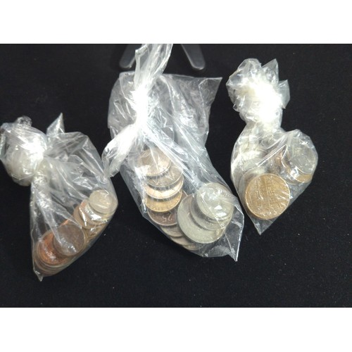 530 - Tub of British and world coins, together with two banknotes, gross weight including tub 1.89kg