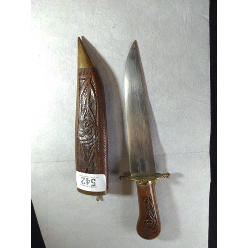 542 - Eastern carved wooden sheathed knife, overall length 26cm