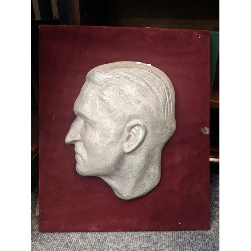 415 - Bust plaque of a mans head in profile, mounted on board, 41 x 49cm overall