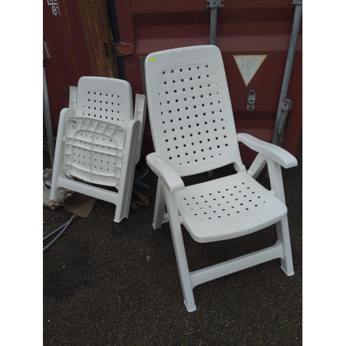 39 - 2 x plastic fold up garden chairs 