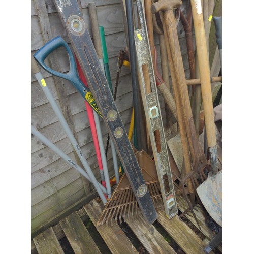 66 - Large quantity of long handled tools 