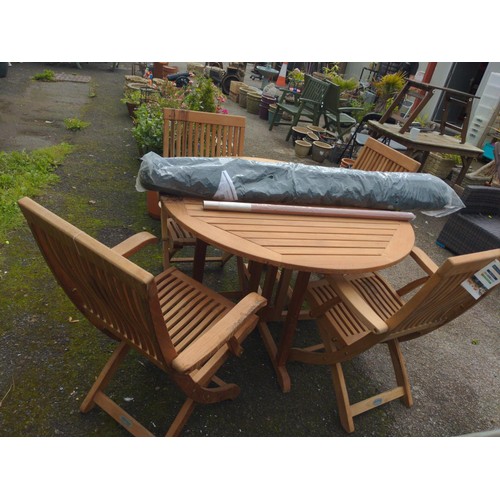 99 - Bridgeman IROKO TECKNIQUE set of four chairs, table + parasol and 3 x seat covers