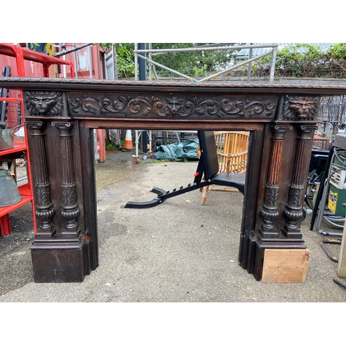 531 - Large decorative oak fire surround . W172 D27 H124 cm approximately.