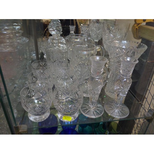 107 - Cut Glass over 3 shelves inc glasses, candlesticks & jugs etc