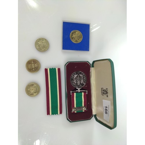 166 - Women's Voluntary Service Medal with ribbon, in presentation Royal Mint case, together with four com... 