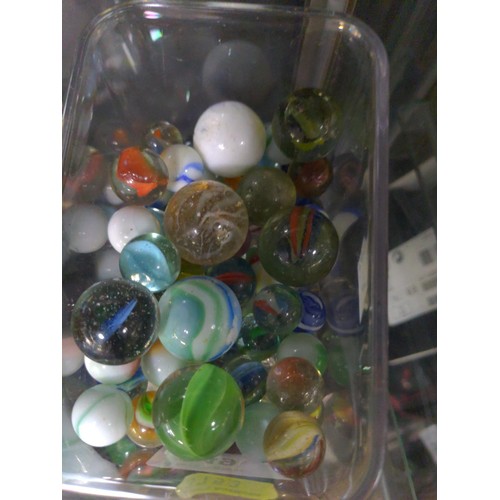 249 - Clear container of marbles