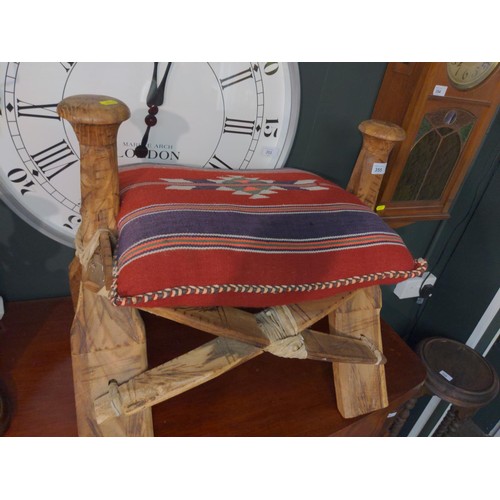 355 - Hard wood frame traditional camel stool with heavy embroidered cushion. W63 H 55 CM