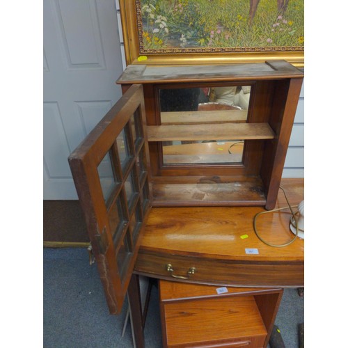 359 - Mahogany free standing glazed cabinet, bun feet and mirrored back and single lockable door. (no key)... 