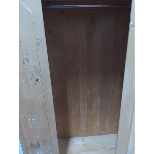 372 - Stripped pine single door, single drawer wardrobe. W108 D47 H194 cm removable top plinth and ceramic... 