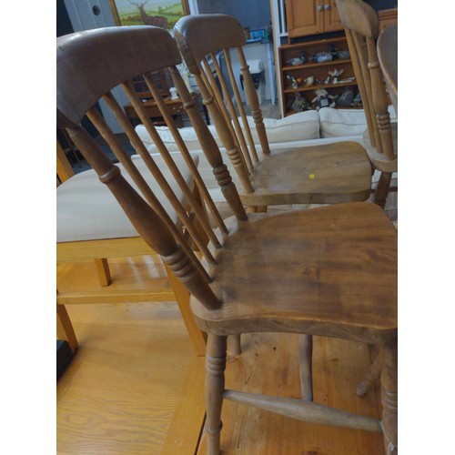 384 - Four small pine kitchen chairs.