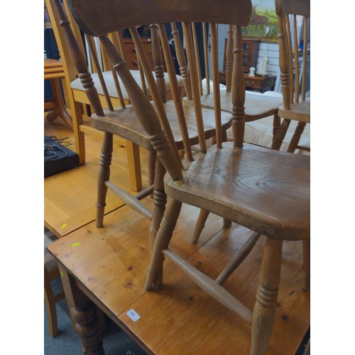 384 - Four small pine kitchen chairs.