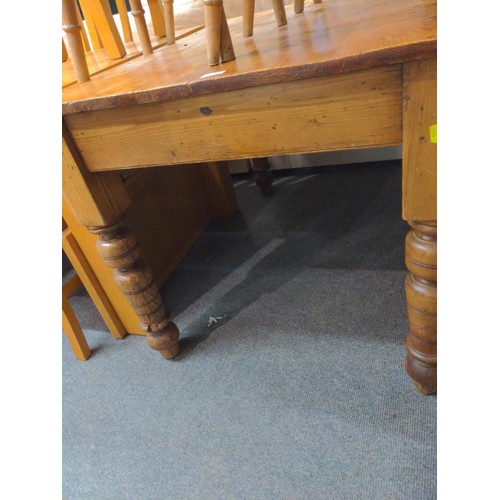 385 - Stripped pine kitchen table with rustic finish. W 117CM x D 82CM X H 76CM. 