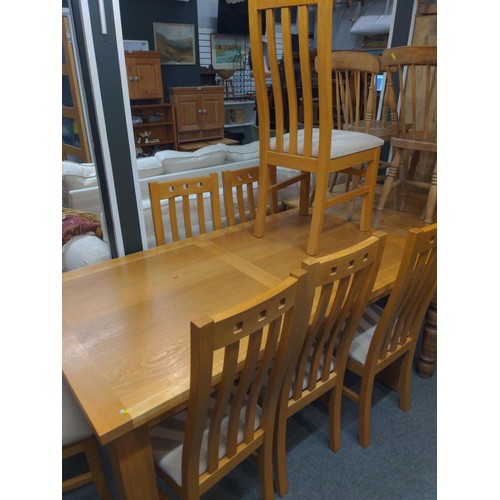 386 - Modern oak extending dining table with 8 chairs. width 160cm x depth 90cm x 76cm height