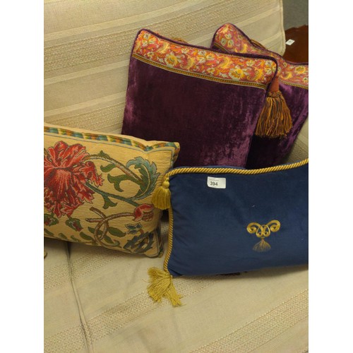 394 - 7 cushions of various designs and sizes