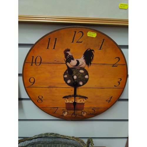 396 - 2 clocks featuring cockerel design. Diameter of largest 35cm.