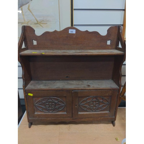 406 - Small oak wall hanging unit with 2 carved doors & shelves. W 57.5 x depth 14.5cm x 63cm.