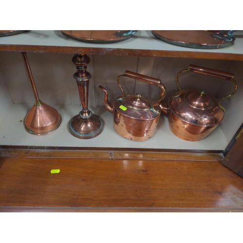 426 - 3 shelves of copper ware inc. copper lids largest 21cm. 2 funnels  other items. 