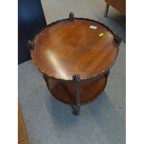 444 - Mahogany 2 tiered circular table 'The Northampton Collection, on brass casters. 45.5cm diameter.