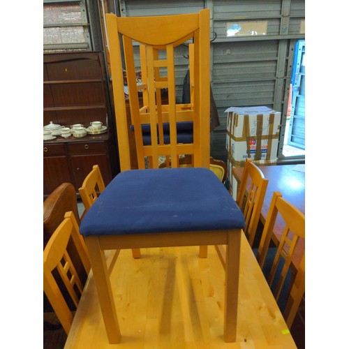 446 - Beech dining table & 8 chairs upholstered in blue cotton.