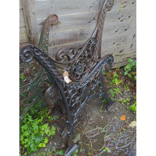 738 - Pair of black metal bench ends