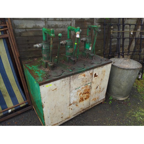 Vintage handpowered oil pump station