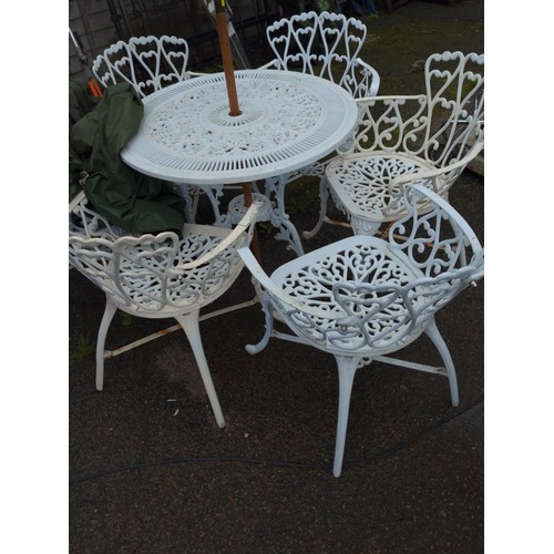 832 - White painted cast aluminium garden table and six chairs, with parasol