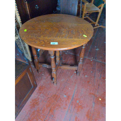 526 - Small oak foldaway circular topped table. D48cm H53cm