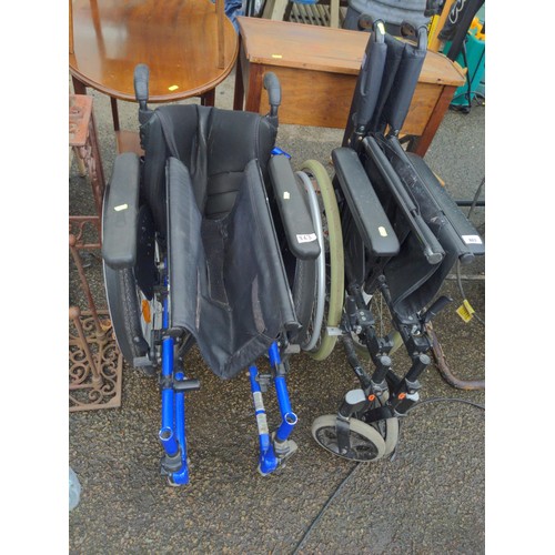 863 - Two folding wheelchairs