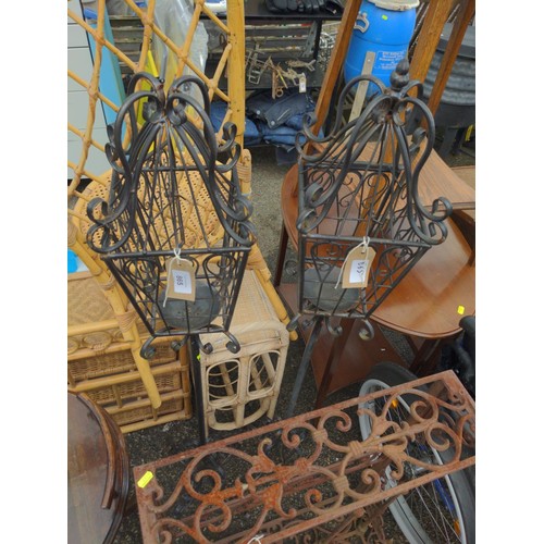 865 - Pair of scroll metal candle lanterns, height 130cm