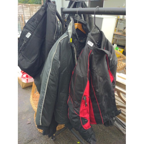 875 - Three motorcycle jackets, sizes XXL and XXXL with XXXL trousers and a Timberland overcoat