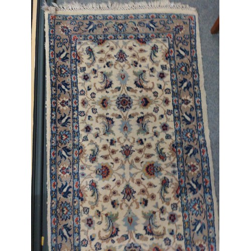 302 - Persian style cream rug with floral border. 170cm x 75cm