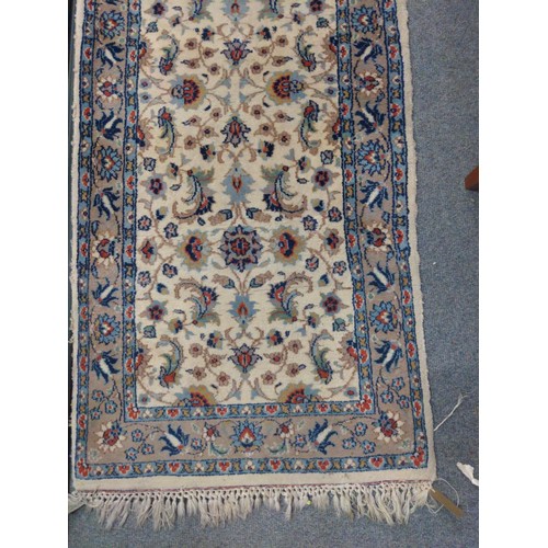 302 - Persian style cream rug with floral border. 170cm x 75cm