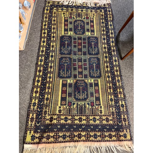 296 - Hand woven Persian rug in navy gold & red. 222cm x 106cm